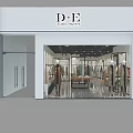 Modern Clothing Store Interior With Display Racks Mannequins And Table Plant