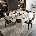 Modern Round Marble Dining Table Set With Six Black And White Chairs And Flower Vase