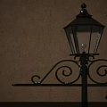 Vintage Outdoor Lamp With Ornate Metal Scroll Design And Glass Shade Casting Shadow On Wall