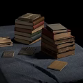 Stacked and Flat Books Display on Blue Cloth With Black Background 3d model