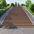 Outdoor Brown Wooden Stairs with Steps and Metal Railings Surrounded by Green Trees and Grass