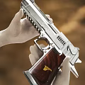 Silver Metal Pistol With Wooden Grip And Golden Emblem Held By White Gloved Hands