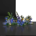 Colorful Floral Decorative Arrangement With Blue Yellow Purple Flowers And Green Plants
