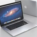 Sleek Apple Laptop Open Screen Showing Galaxy Display With Silver Body And Desktop Icons