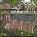 Wooden Guesthouse Buildings With Balconies Amid Cherry Blossom Trees And Green Lawn