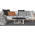 Patterned Sofa With Multicolored Cushions And Black Round Coffee Table Set On Striped Rug 3d model