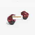 Red Toad Figurines With Green Eyes As Decorative Ornaments On White Background