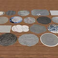 Round Rugs with Various Patterns and Designs Displayed on Wooden Floor 3d model