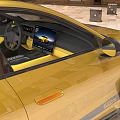 Yellow Stylish Sports Car Parked On Old Streets With Ancient Buildings