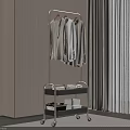 Modern Clothes Hanger with Lower Shelf Folded Towels and White Basket in Minimalist Interior