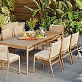 Outdoor Patio Dining Table And Chairs Set With Beige Umbrella And Green Plants