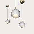 Modern Silver Spherical Pendant Lights With Gold Metal Fittings Glowing Against Light Background