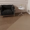 Modern Side Table with Black Chair Vase Flowers on Light Colored Wall Wooden Floor