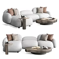 White Sectional Sofa with Brown and Beige Cushions and Side Coffee Tables with Magazines