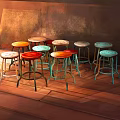Colorful Bar Stools With Metal Legs Round Seats On Wooden Floor And Warm Wall