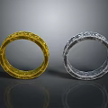 Elegant Golden And Silver Decorative Rings With Intricate Carved Patterns