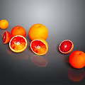 Fresh Ripe Whole And Sliced Blood Oranges With Reflection On Dark Background