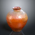Sculptural Carving Of Reddish Brown Glossy Textured Vase With Spherical Shape And Narrow Neck