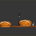 Fresh Homemade Bread on Wooden Cutting Board with Knives Grater and Salt Pepper Shakers