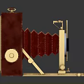 Vintage Red Foldable Camera With Golden Lens And Leather Body Design