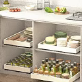 Kitchen Cabinet Interior With Drawers Storing Dishes Bowls And Condiment Jars