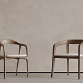Wooden Chairs With Curved Arms And White Cushions Against Light Gray Wall