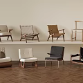 Armchair Collection With Various Woven And Upholstered Designs On Herringbone Floor And Light Wall