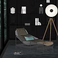 Modern Metal Frame Lounge Chair With Green Throw Pillow And Floor Lamp Near Open Shelving Decorative Items