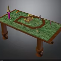 Wooden Table With Green Tabletop And Colorful Models Pink Tower Yellow Castle And Green Figure