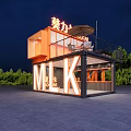 Modern Container Building With Illuminated Sign Orange Design Balcony And Surrounding Trees At Night