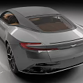Aston Martin Silver Sports Car Featuring Sleek Body Design Black Alloy Wheels Brown Leather Interior