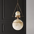 Modern Golden Double Sphere Chandelier with Moon Surface Texture on Dark Wall Background