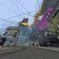 Stylish Modern Commercial Complex With Glass Facades Illuminated Structures And Pedestrian Areas