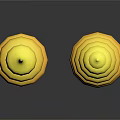 Two Yellow Spiral Stacked Sculptures With Reflective Bases On Dark Surface