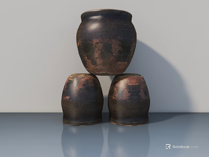 Three Dark Textured Ceramic Vessels Stacked On Smooth Reflective Surface 3d model