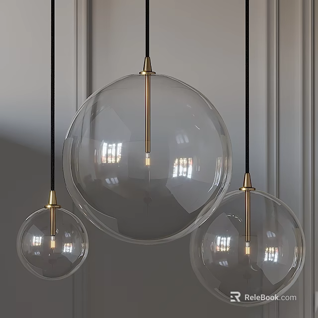 Three Modern Pendant Lights With Transparent Glass Globes And Golden Metal Accents 3d model 