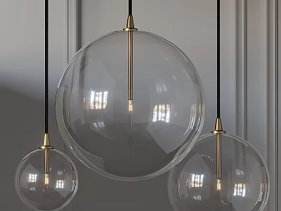 Three Modern Pendant Lights With Transparent Glass Globes And Golden Metal Accents 3d model