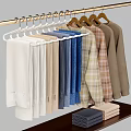 Long Sleeve Clothes In Assorted Colors Hanging On White And Brown Hangers