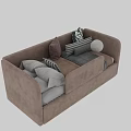 Two seater sofa in beige and brown with striped geometric pillows and folded blankets