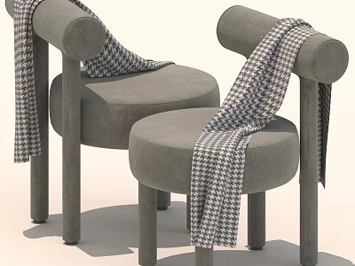 Two Gray Round Chairs With Black And White Checkered Scarves Draped Over 3d model