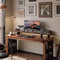 Wooden Office Desk With Mountain View Monitor Desk Lamp Potted Plant And Decorative Wall Art