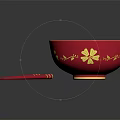 Red Bowl With Yellow Interior And Gold Flower Designs Plus Red Chopsticks With Gold Accents