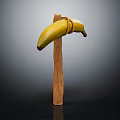 Ripe Banana Tied to Wooden Stick for Artistic Display on Dark Background