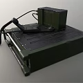 Green Military Style Television Set With Digital Display Control Buttons And Cable Design