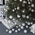 Christmas Tree Decorated With Silver And White Balls Near Fireplace With Wreath Candles And Lanterns