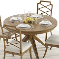 Wooden Round Dining Table Set with Upholstered Chairs Wine Glasses Plates and Lemon Bowl