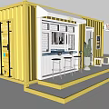 Yellow Shipping Container Cafe Building With Awning Outdoor Seating And Menu Board