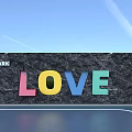 Stone Building Facade with PARK Sign Colorful LOVE Letters under Blue Sky Green Grass