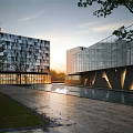 Modern Sales Office Building With Glass Curtain Walls And Water Pool Surroundings