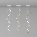 Three Modern White Chandeliers With Hanging Pendant Lights On Gray Ceiling